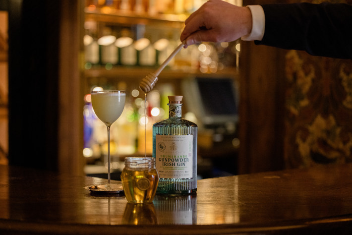 Photo of a cocktail made using the new Ashford Castle Drumshanbo Gunpowder Irish Gin and honey